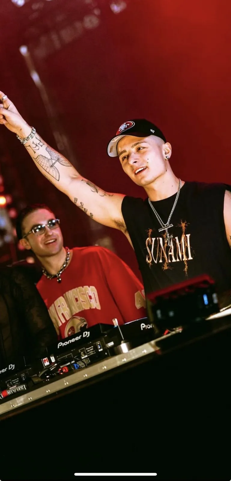 Prospa on the decks wearing their Smother Brothers pendants